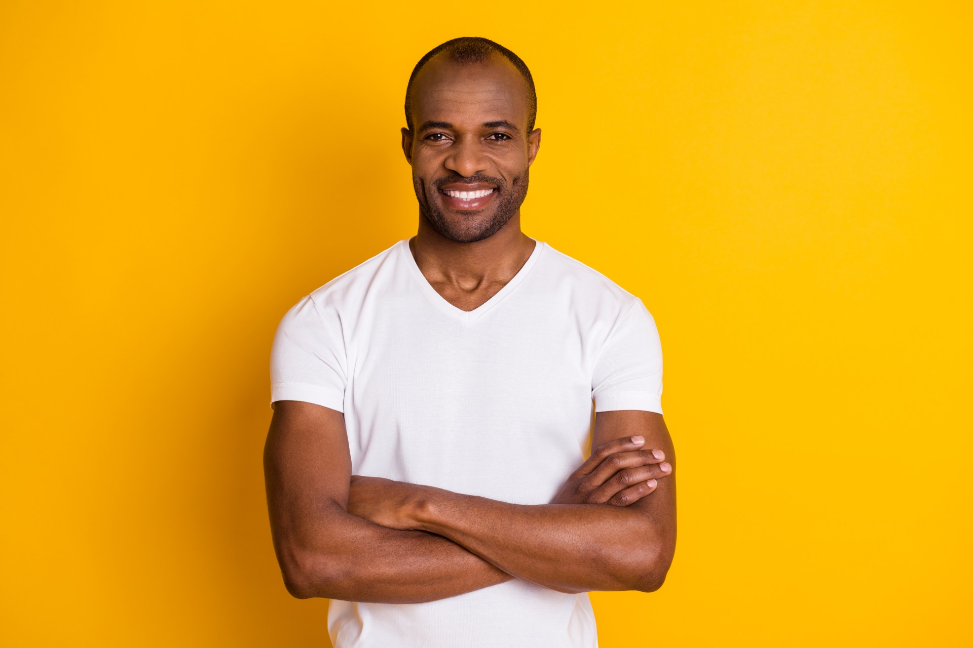Handsome Black man smiling with white teeth
