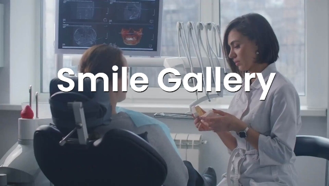 Female dentist with patient discussing our smile gallery