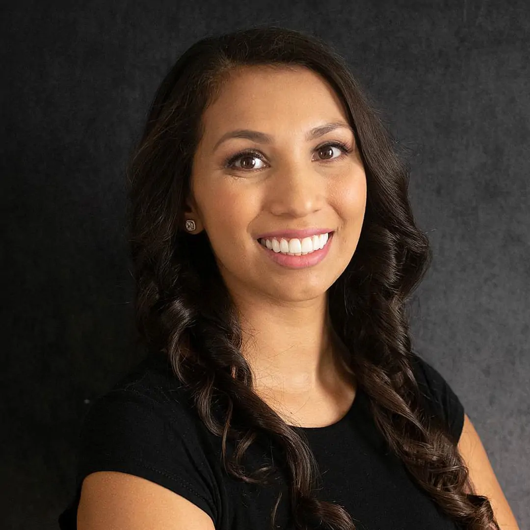 Portrait close up of beautiful young Latina woman with gorgeous smile