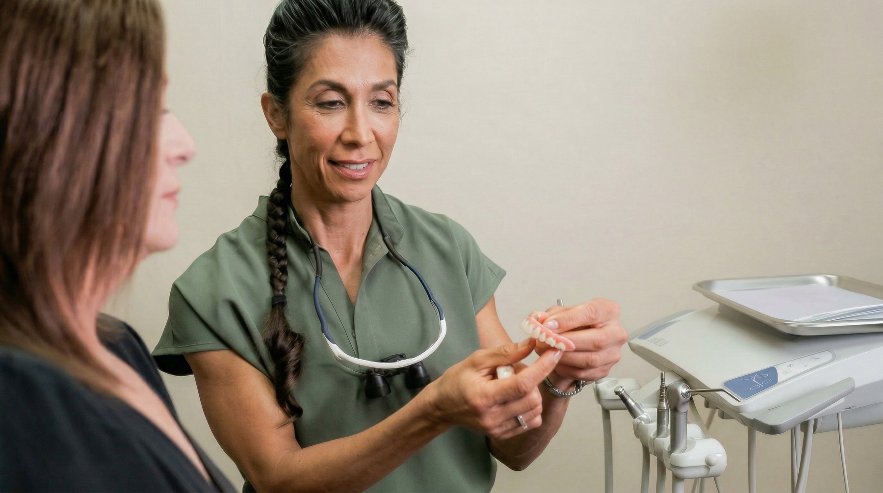 Dr. Pournik giving a patient a consultation