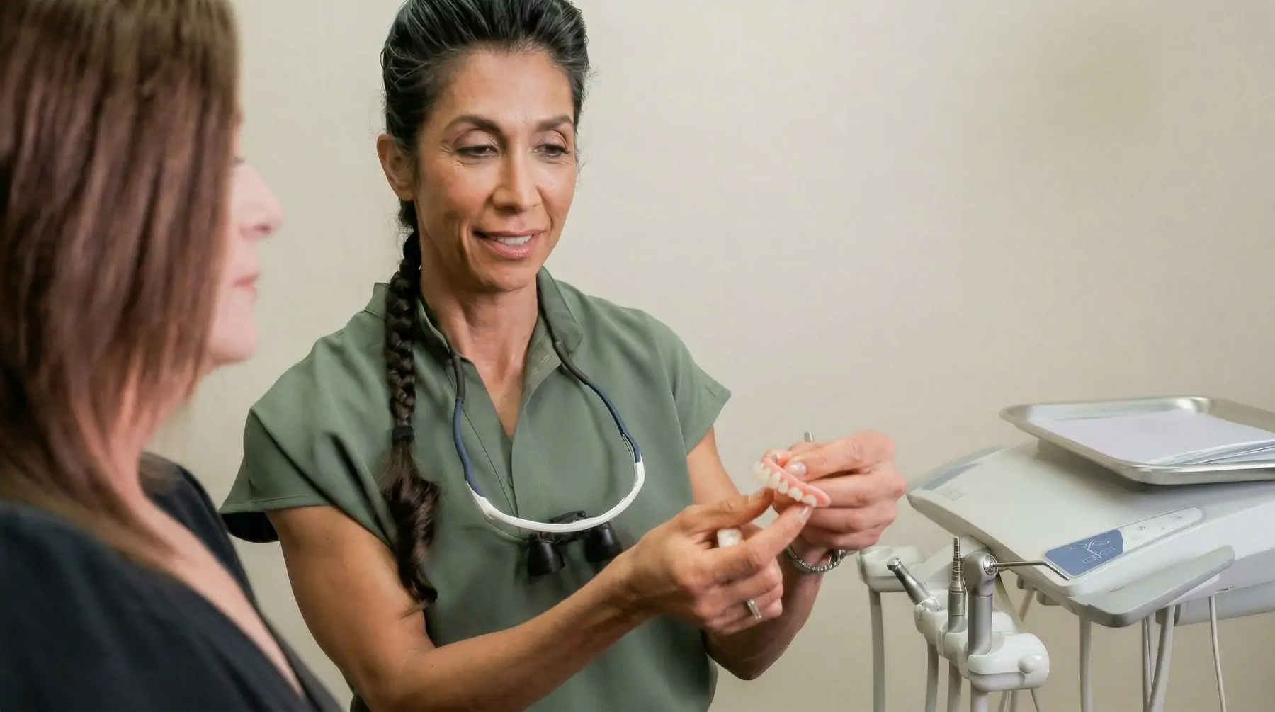 Dr. Pournik giving a patient a consultation